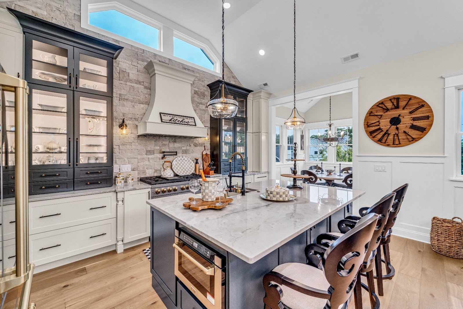 Custom kitchen remodel by Kitch Designs in Cherry Hill, NJ — two-tone cabinetry, quartz island and pendant lighting