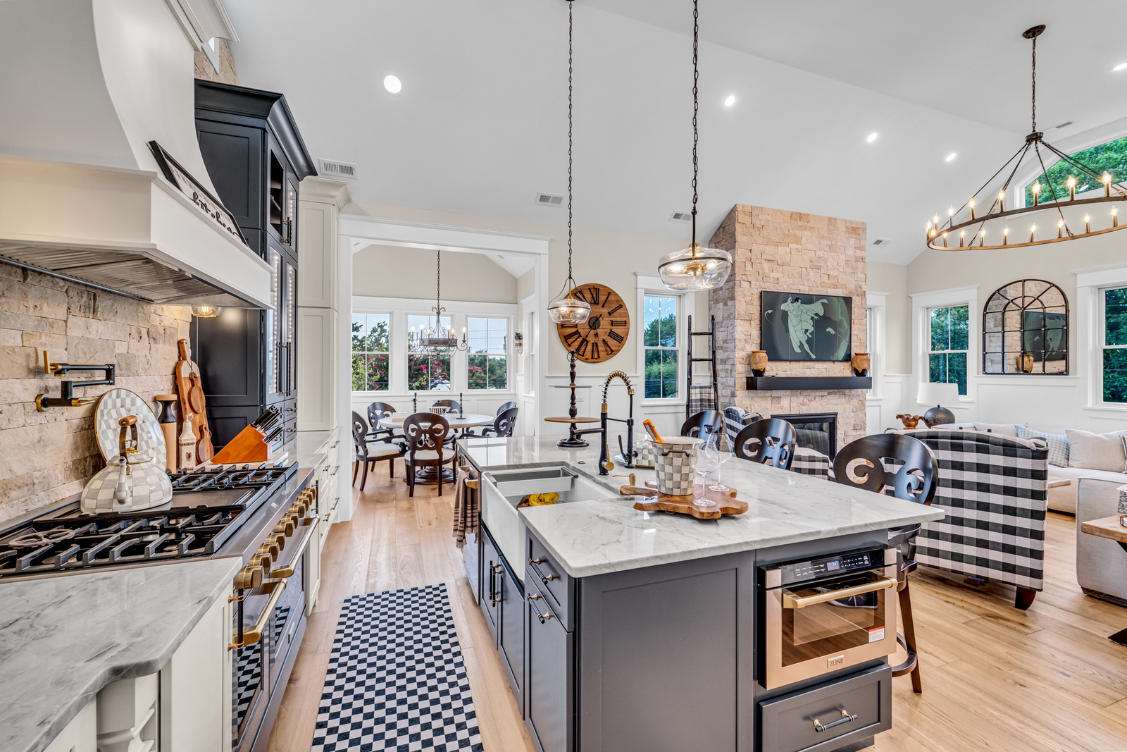 Premium kitchen with stone hood, glass-front cabinets and quartzite counters